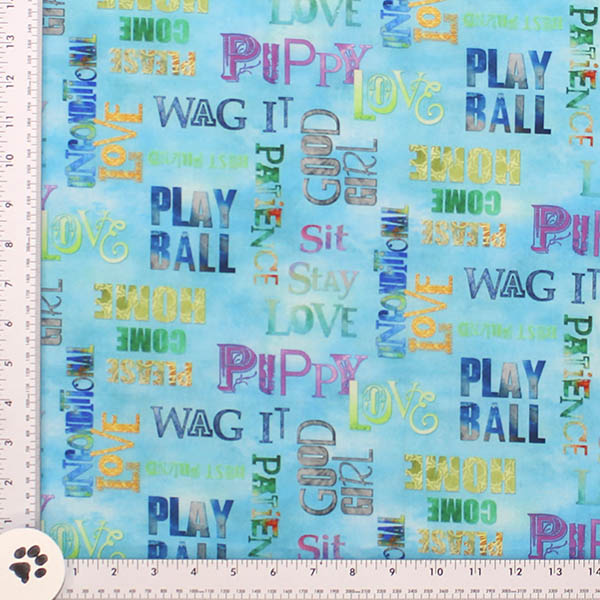Puppy Love Print Fabric printed on all cotton light turquoise with Fun Puppy Words throughout. Fabric is 44 inches wide. Manufactured by Three Wishes Fabric company.