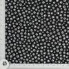 White Paws on Black Print Fabric is a collection of small dog paws on a black background on all cotton fabric/44" wide, by Elizabeth's Studio